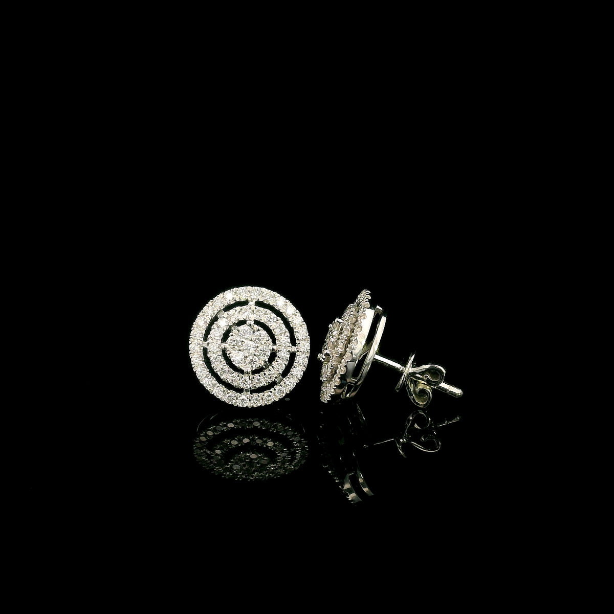Diamond circle stud earrings in 18K white gold featuring concentric rows of round brilliant diamonds.