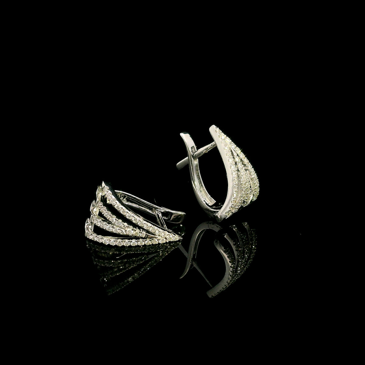 Multi-row diamond hoop earrings in 18K white gold with layered sweeping rows of round brilliant diamonds by Emirates Diamonds.