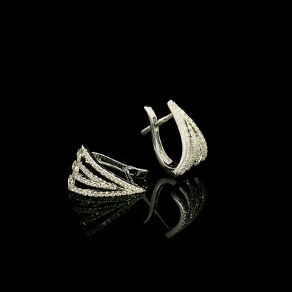 Multi-row diamond hoop earrings in 18K white gold with layered sweeping rows of round brilliant diamonds by Emirates Diamonds.