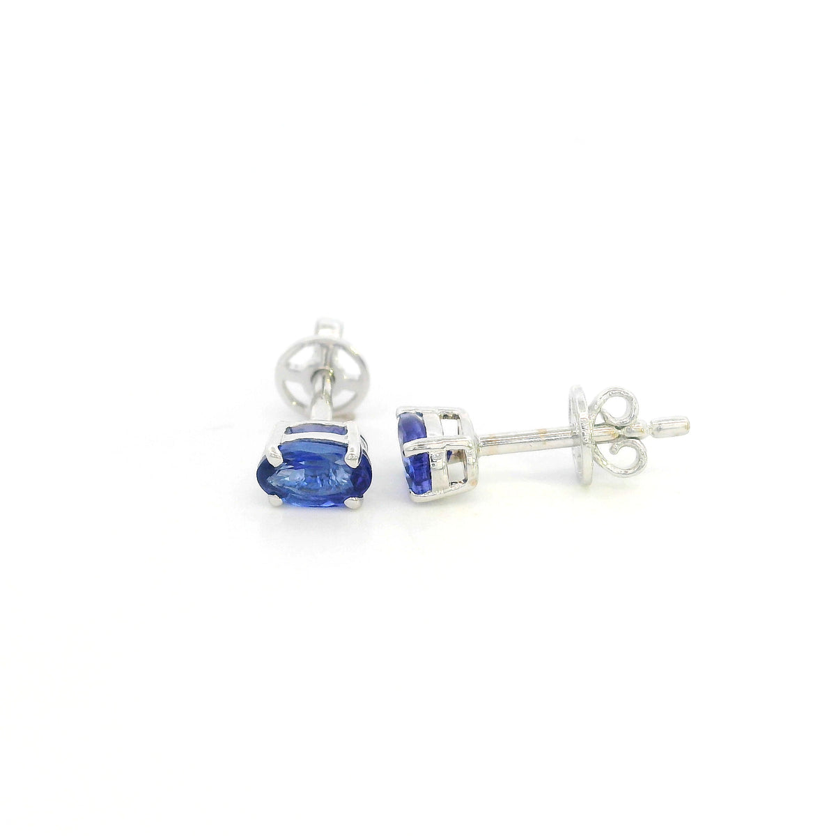 Oval tanzanite solitaire stud earrings in 18K white gold featuring natural blue-violet tanzanites by Emirates Diamonds.