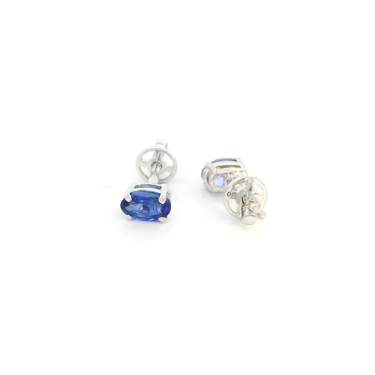 Oval tanzanite solitaire stud earrings in 18K white gold featuring natural blue-violet tanzanites by Emirates Diamonds.