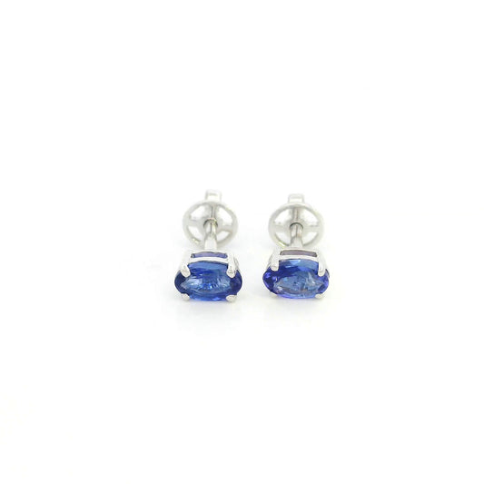 Oval tanzanite solitaire stud earrings in 18K white gold featuring natural blue-violet tanzanites by Emirates Diamonds.