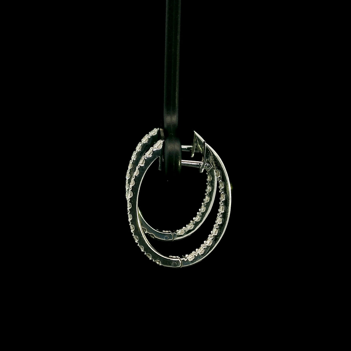 18K white gold inside out diamond hoop earrings with round brilliant diamonds set along the outer front and inner back surfaces.