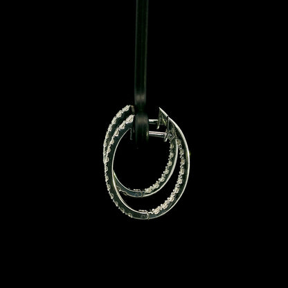 18K white gold inside out diamond hoop earrings with round brilliant diamonds set along the outer front and inner back surfaces.
