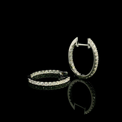 18K white gold inside out diamond hoop earrings with round brilliant diamonds set along the outer front and inner back surfaces.