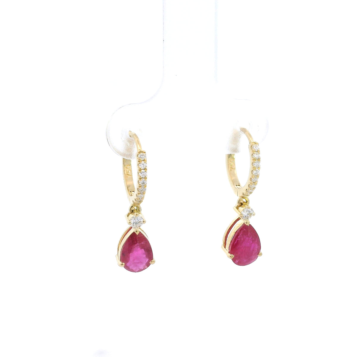Pear-shaped ruby drop earrings with diamond-set huggie hoops in 18K yellow gold by Emirates Diamonds.