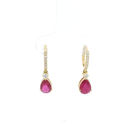 Pear-shaped ruby drop earrings with diamond-set huggie hoops in 18K yellow gold by Emirates Diamonds.