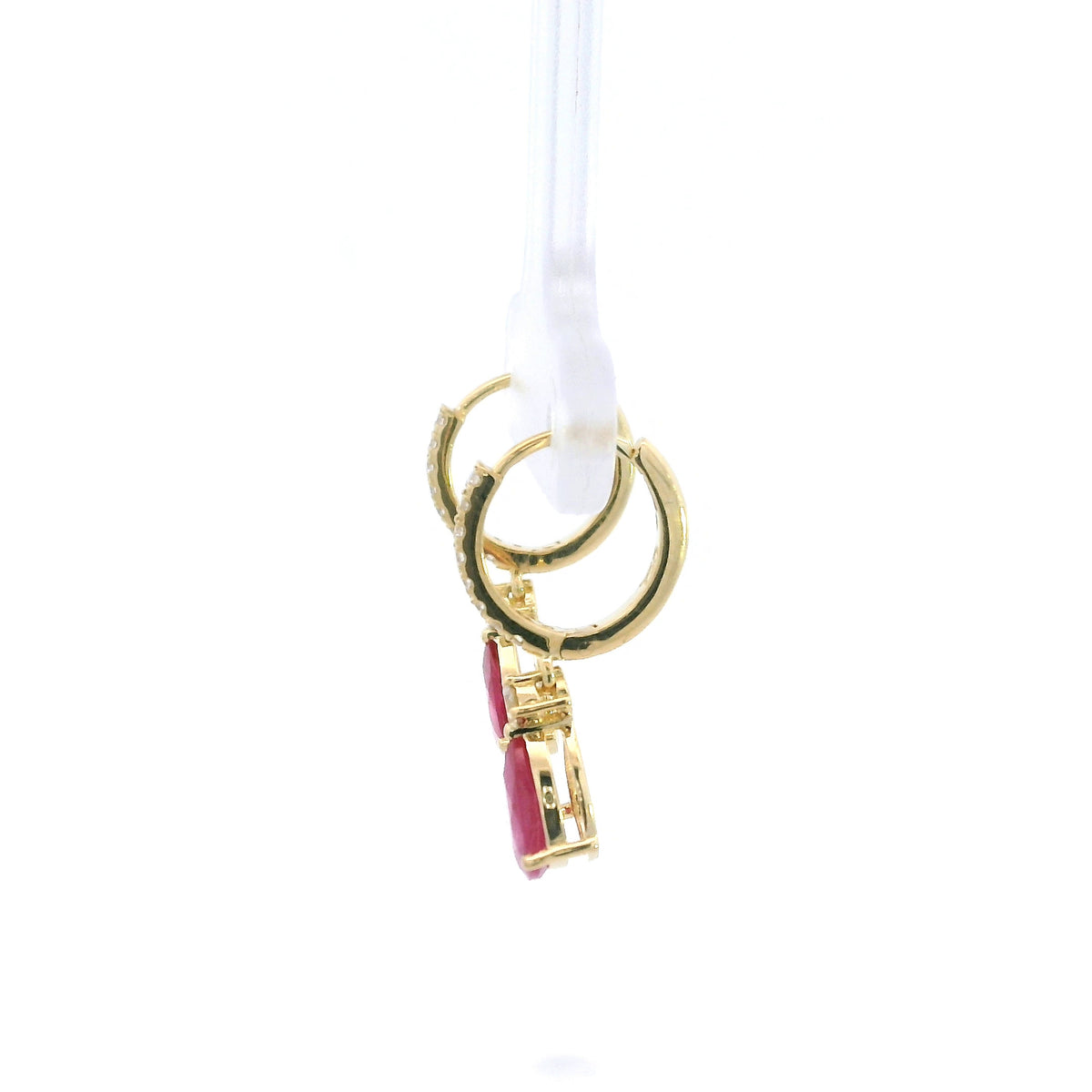 Pear-shaped ruby drop earrings with diamond-set huggie hoops in 18K yellow gold by Emirates Diamonds.