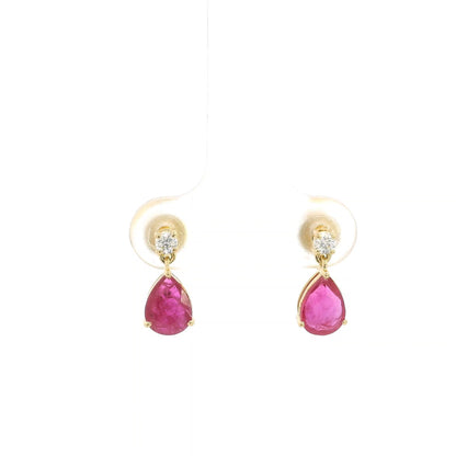 Pear shaped ruby and diamond drop earrings in 18K yellow gold with round diamond accents