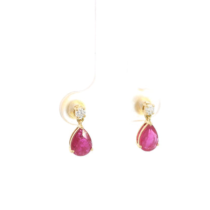 Pear shaped ruby and diamond drop earrings in 18K yellow gold with round diamond accents