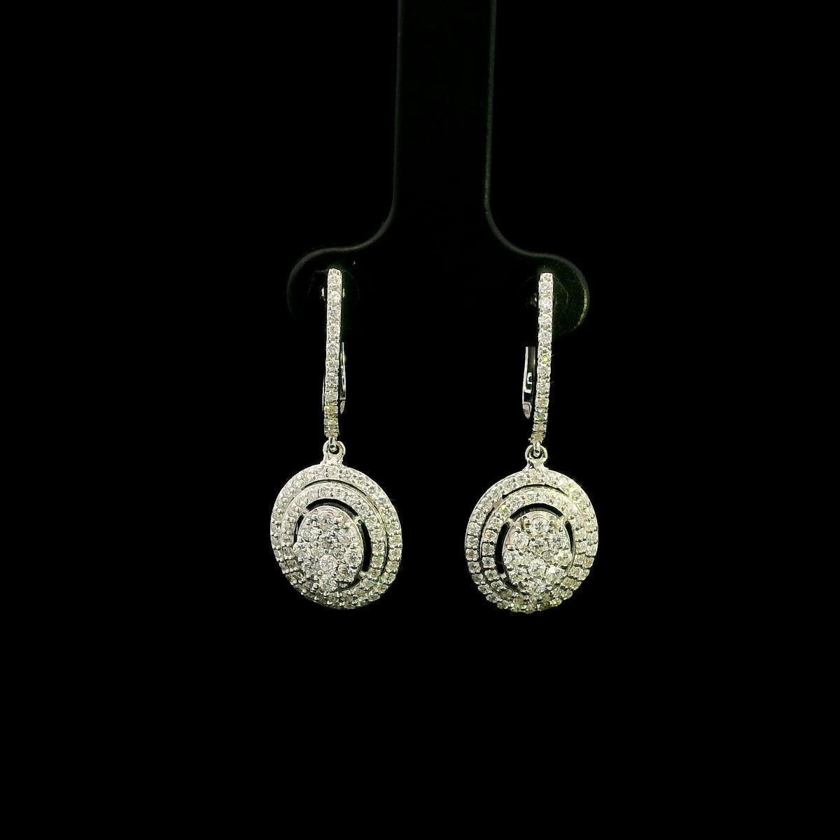 Oval diamond drop earrings in 18K white gold with multi-row diamond design