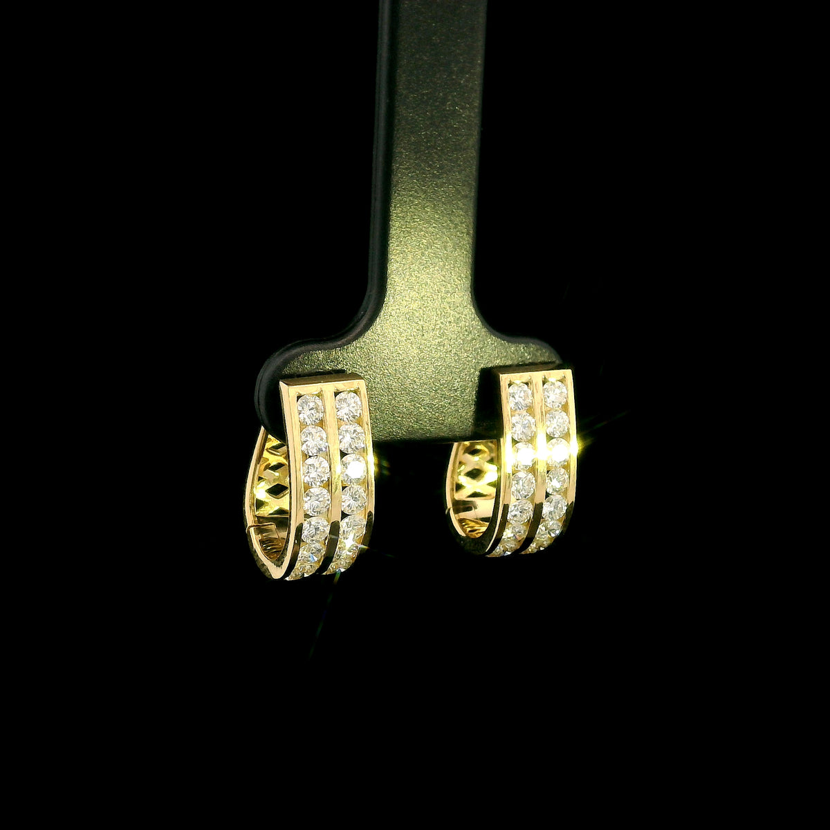Double row diamond hoop earrings in 18K yellow gold featuring two parallel rows of round brilliant diamonds.