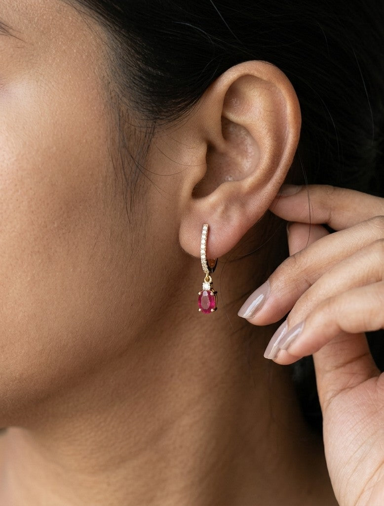 Ruby and diamond drop earrings in 18K yellow gold with oval ruby drops and diamond set hoops