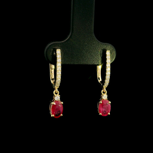 Ruby and diamond drop earrings in 18K yellow gold with oval ruby drops and diamond set hoops