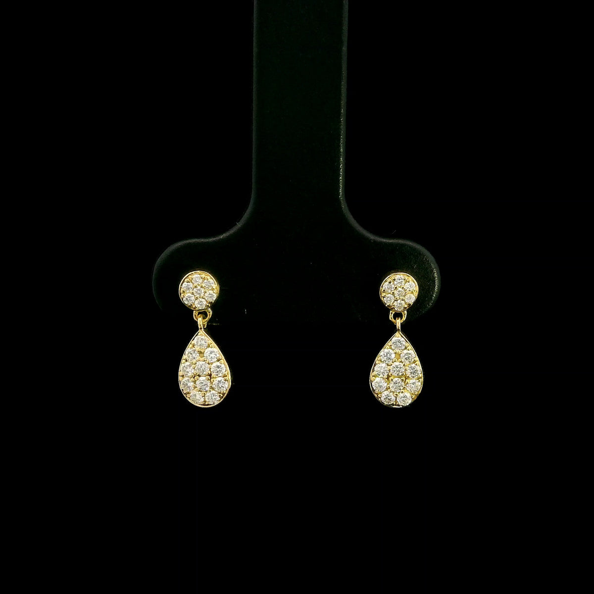 Diamond drop earrings with pear shaped teardrop design in 18K yellow gold