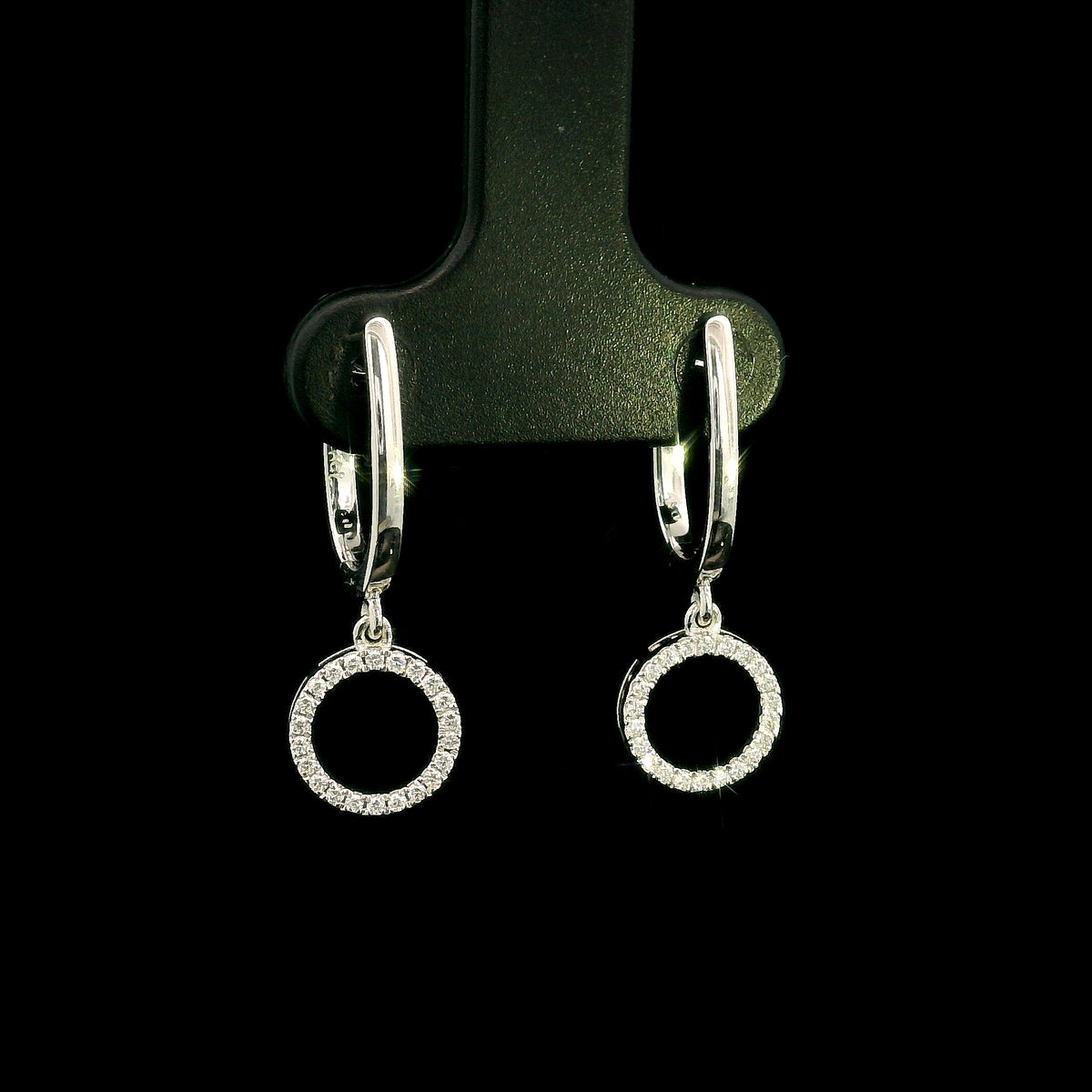 Diamond drop earrings in 18K white gold with polished hoops and circular diamond drops