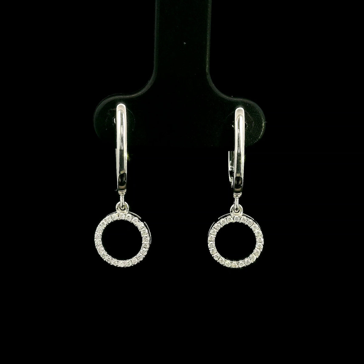 Diamond drop earrings in 18K white gold with polished hoops and circular diamond drops