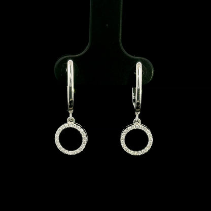 Diamond drop earrings in 18K white gold with polished hoops and circular diamond drops