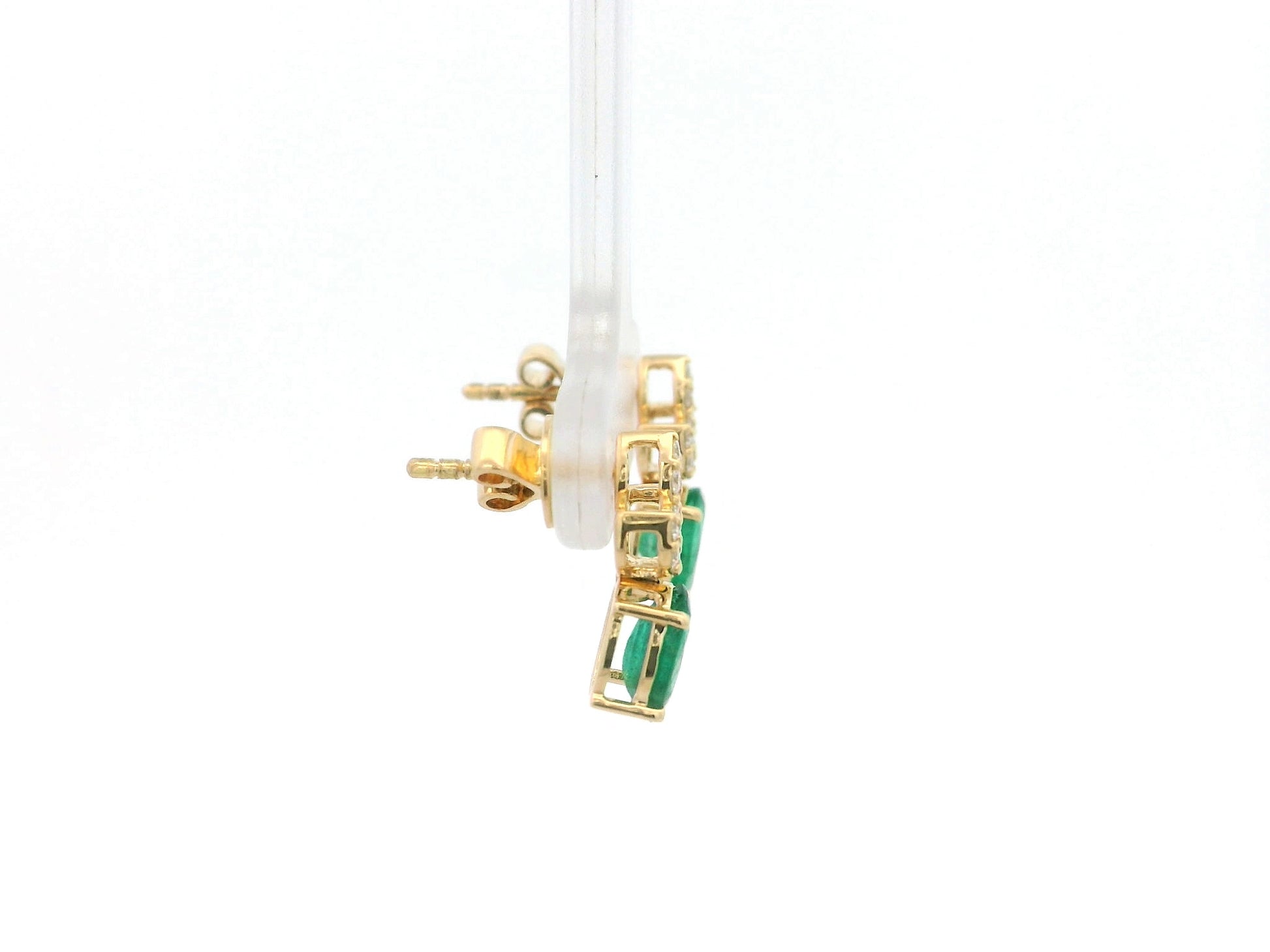 Emerald and diamond accent earrings in 18K yellow gold featuring 1.14 carat emeralds and 0.19 carat diamonds by Emirates Diamonds.