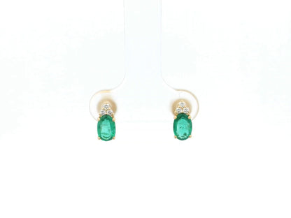 Emerald and diamond drop earrings in 18K yellow gold featuring 0.78 carat emeralds and 0.07 carat diamonds by Emirates Diamonds.