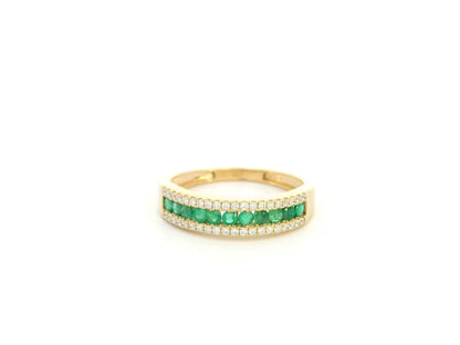 Emerald and diamond band ring in 18K yellow gold with channel set design by Emirates Diamonds