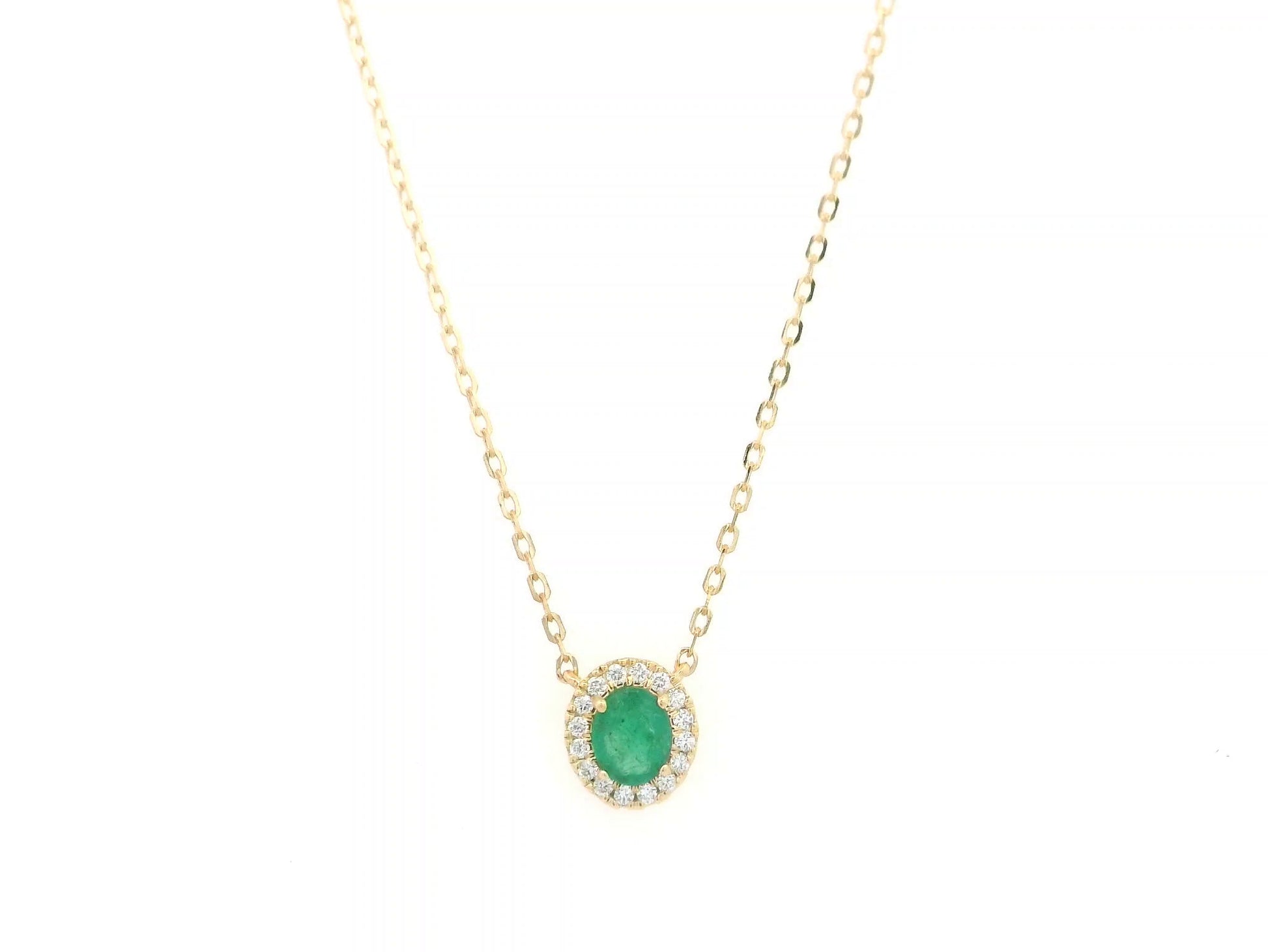 Emerald and diamond halo necklace in 18K yellow gold featuring 0.51 carat emerald and 0.10 carat diamonds by Emirates Diamonds.