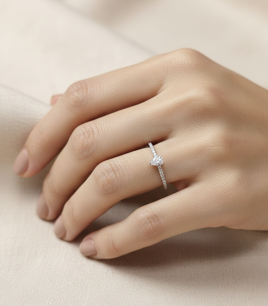 0.19 carat pear diamond engagement ring in 18K white gold with pavé band by Emirates Diamonds