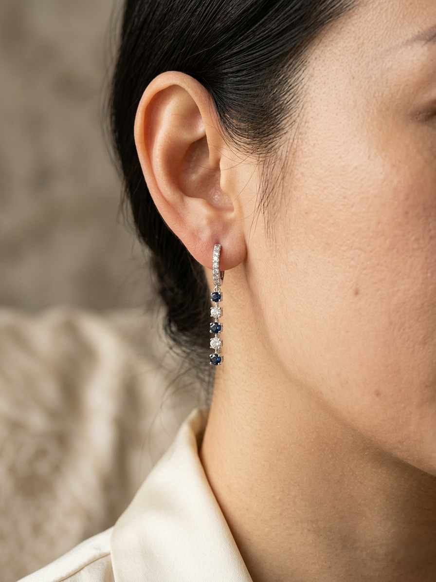 18K white gold sapphire and diamond drop earrings with hinged huggie closure by Emirates Diamonds