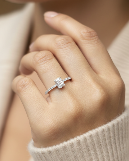 Emerald-cut diamond engagement ring in 18K white gold with D-color VVS1 GIA-certified center stone and pave band – Emirates Diamonds.