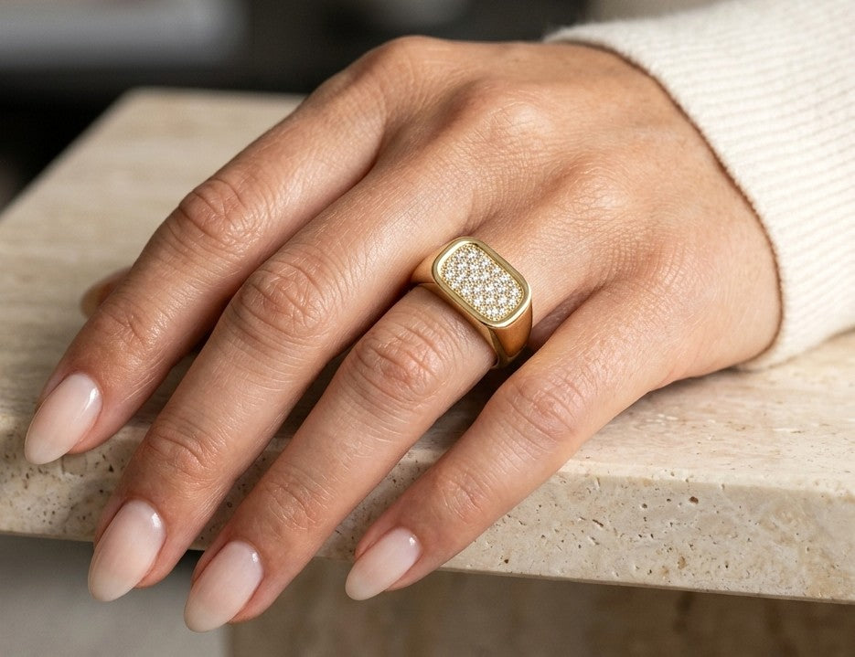 18K yellow gold pavé diamond signet ring with a rectangular diamond-set top and polished tapered band.