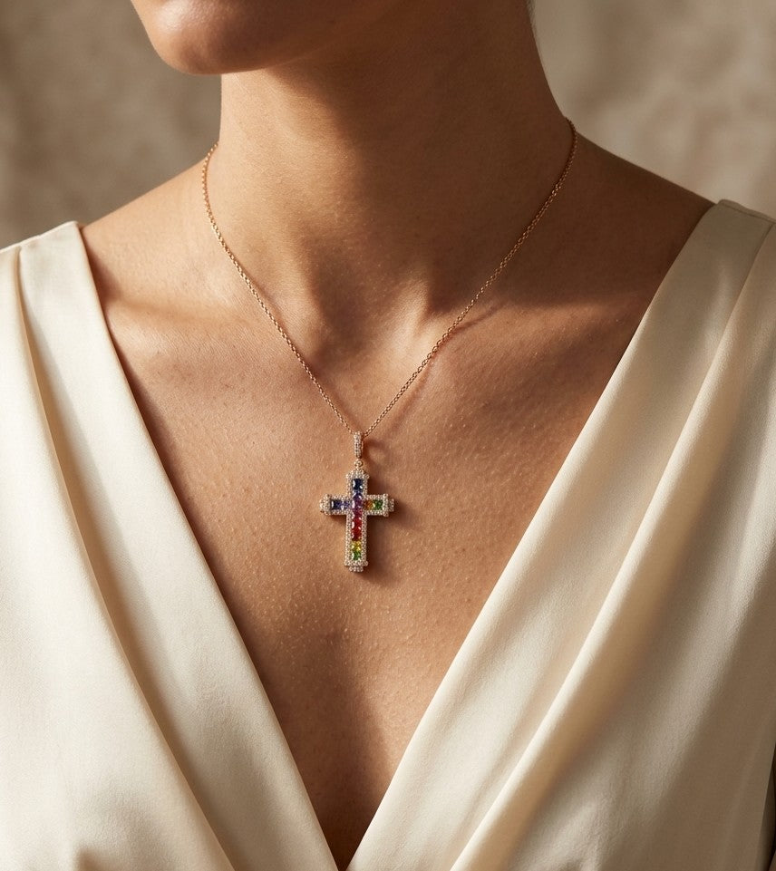 Multicolour sapphire and diamond cross necklace in 18K rose gold with colourful sapphires, diamond border and diamond-set bail.