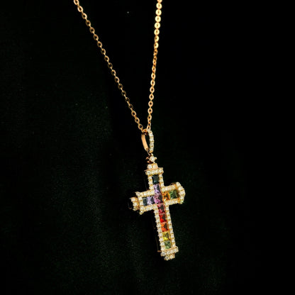 Multicolour sapphire and diamond cross necklace in 18K rose gold with colourful sapphires, diamond border and diamond-set bail.