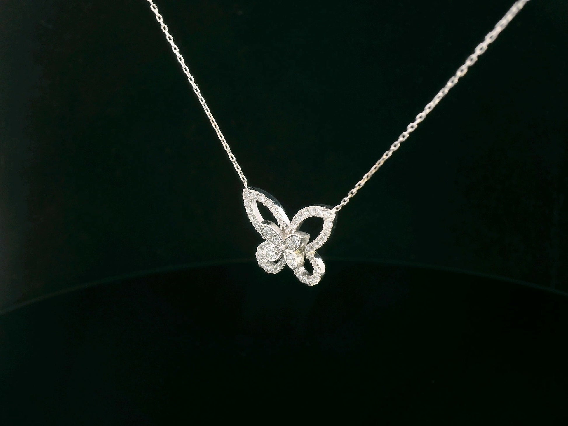 18K gold butterfly pendant featuring 0.41 CT natural diamonds in a delicate openwork design. Chain not included.