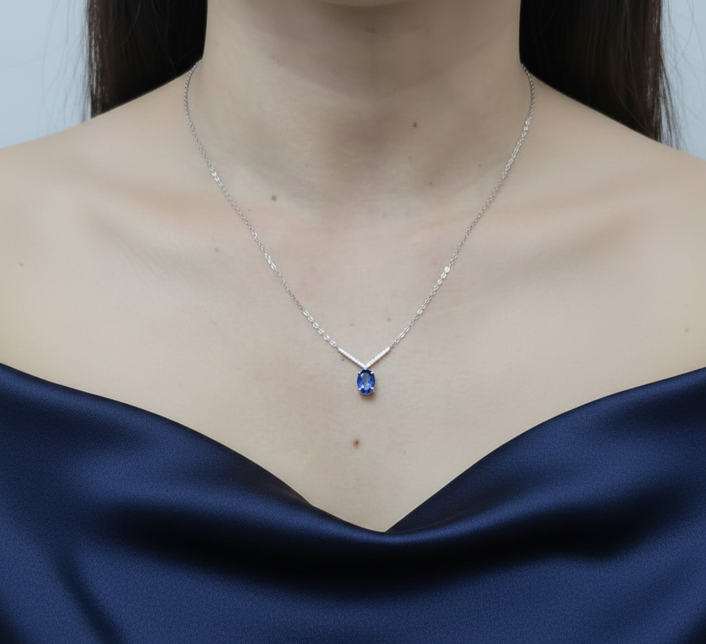 18K white gold tanzanite and diamond V-pendant necklace by Emirates Diamonds