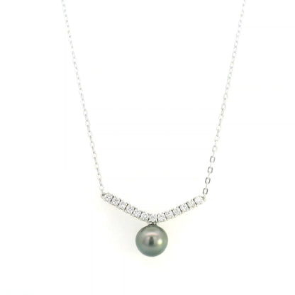 Tahitian black pearl and diamond necklace in 18K white gold featuring a dark grey pearl suspended beneath a gently curved row of round diamonds on a delicate white gold chain.