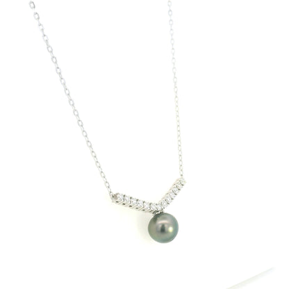 Tahitian black pearl and diamond necklace in 18K white gold featuring a dark grey pearl suspended beneath a gently curved row of round diamonds on a delicate white gold chain.