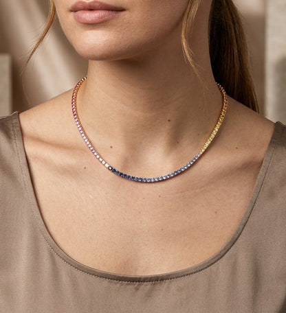 Multicolour sapphire tennis necklace in 18K rose gold featuring a continuous row of round pink, yellow and blue sapphires arranged in gradual colour transitions, with a total sapphire weight of 18.17 carats.