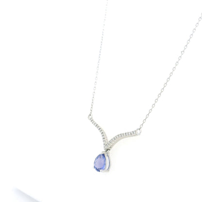 Pear shaped tanzanite and diamond necklace in 18K white gold featuring a blue-violet tanzanite drop suspended beneath two curved diamond-set bars forming a V-shaped design.