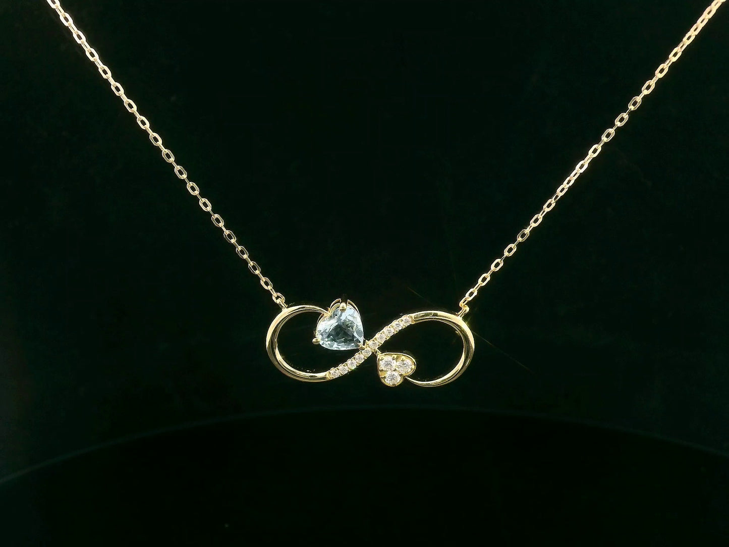 18K yellow gold infinity necklace with aquamarine and diamonds