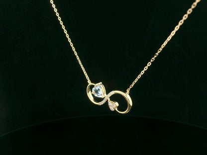 Yellow gold pendant with diamonds and aquamarine gemstone