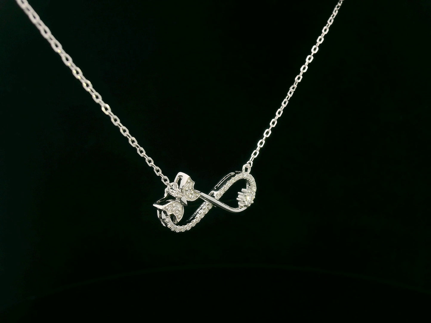 18K White Gold Diamond Infinity Bow Necklace, 0.23 Carat Round Diamonds, Elegant Symbolic Pendant