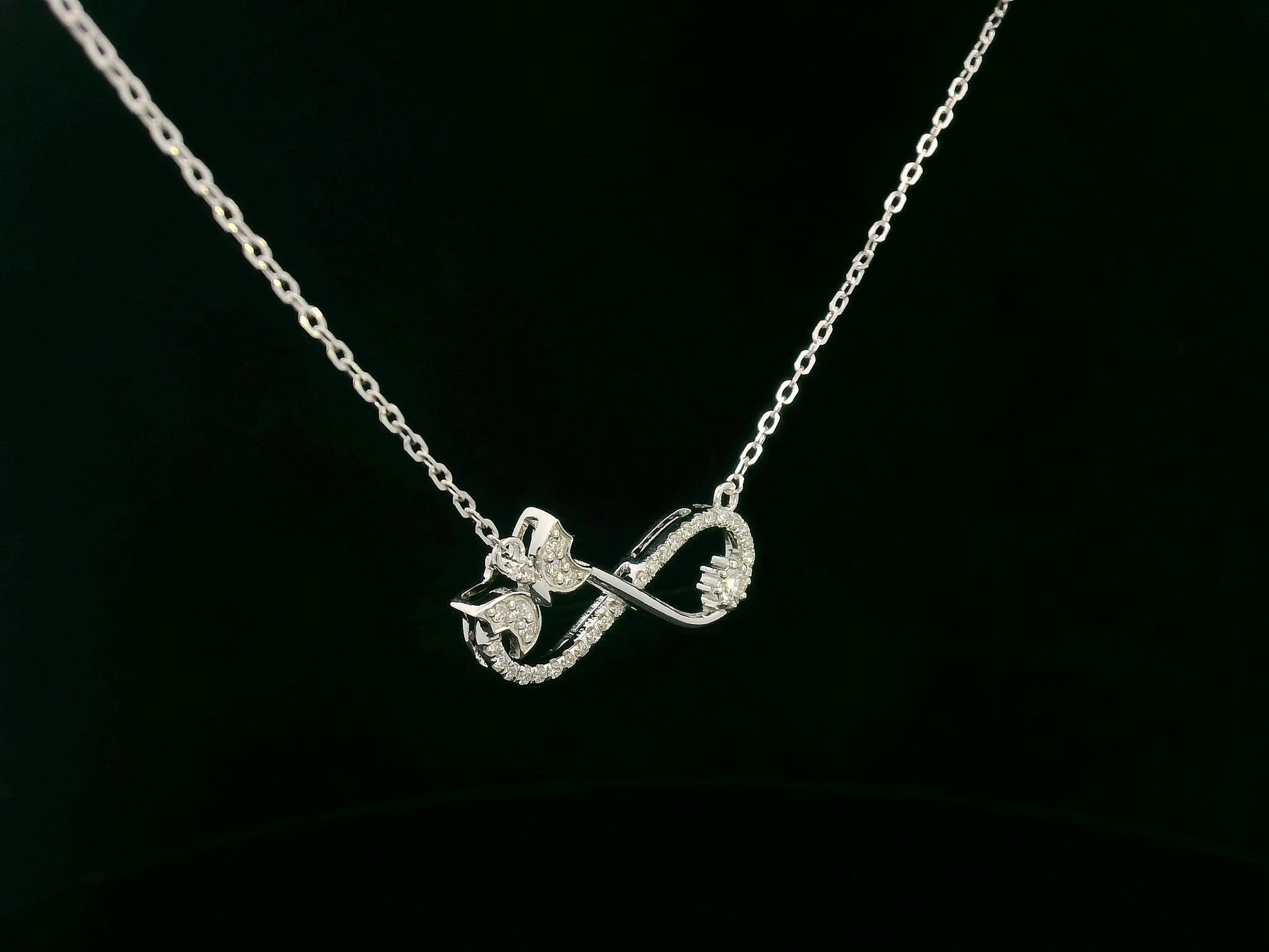 18K White Gold Diamond Infinity Bow Necklace, 0.23 Carat Round Diamonds, Elegant Symbolic Pendant