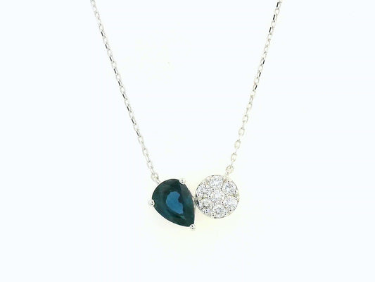18K white gold pendant featuring a 0.97 carat pear-cut blue sapphire and 0.17 carat round diamond cluster on a fine gold chain.