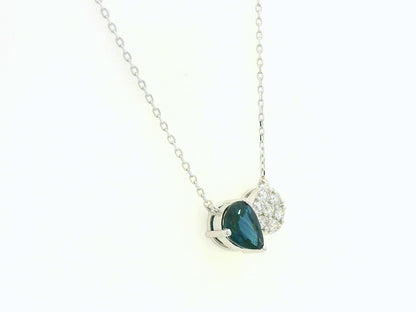 18K white gold pendant featuring a 0.97 carat pear-cut blue sapphire and 0.17 carat round diamond cluster on a fine gold chain.