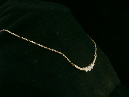 18K yellow gold diamond curve necklace – 0.15ct round brilliant diamonds in curved bar design, fine jewelry by Emirates Diamonds