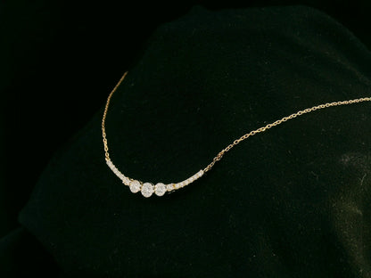 18K yellow gold diamond curve necklace – 0.15ct round brilliant diamonds in curved bar design, fine jewelry by Emirates Diamonds