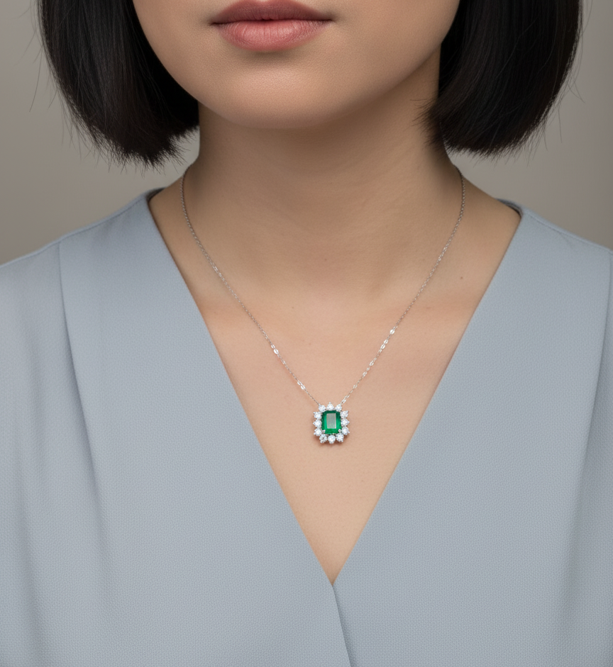 Emerald and diamond halo necklace in 18K white gold – 3.09ct emerald with 1.41ct diamond halo, fine jewelry by Emirates Diamonds