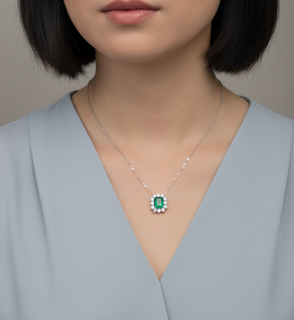 Emerald and diamond halo necklace in 18K white gold – 3.09ct emerald with 1.41ct diamond halo, fine jewelry by Emirates Diamonds