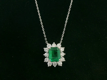 Emerald and diamond halo necklace in 18K white gold – 3.09ct emerald with 1.41ct diamond halo, fine jewelry by Emirates Diamonds