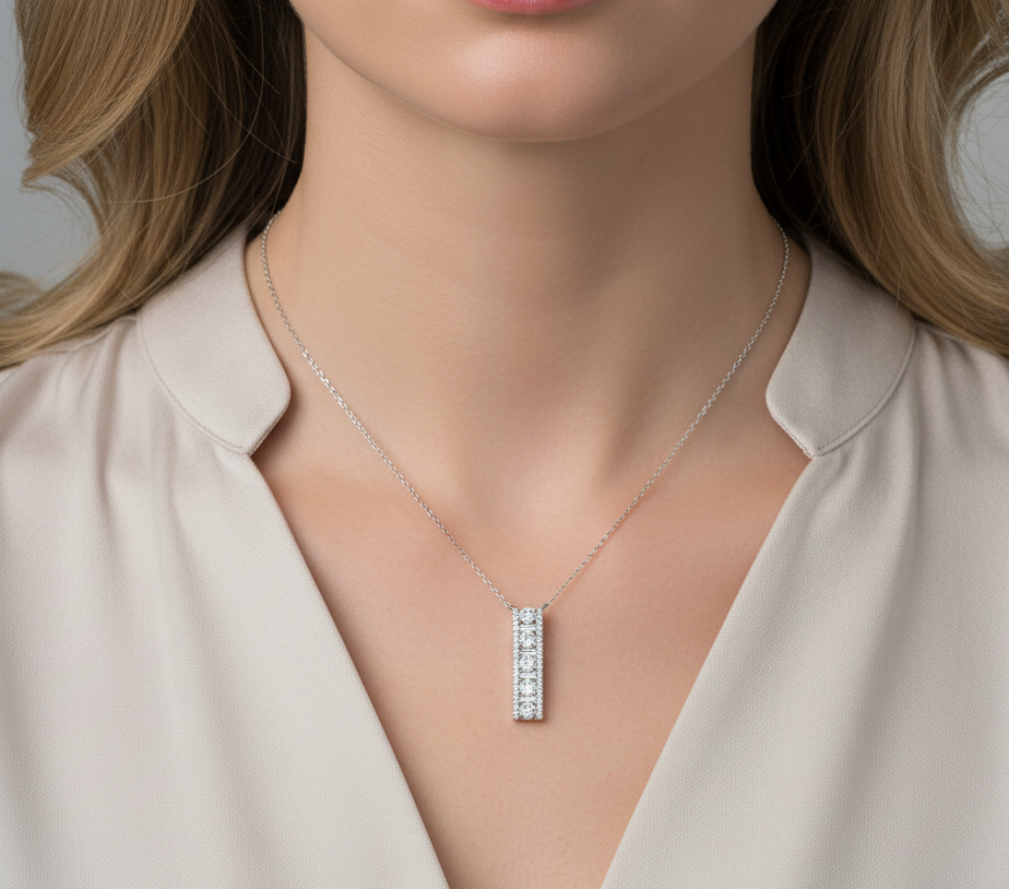 18K white gold diamond bar pendant with round and baguette-cut diamonds — 0.86ct Emirates Diamonds.